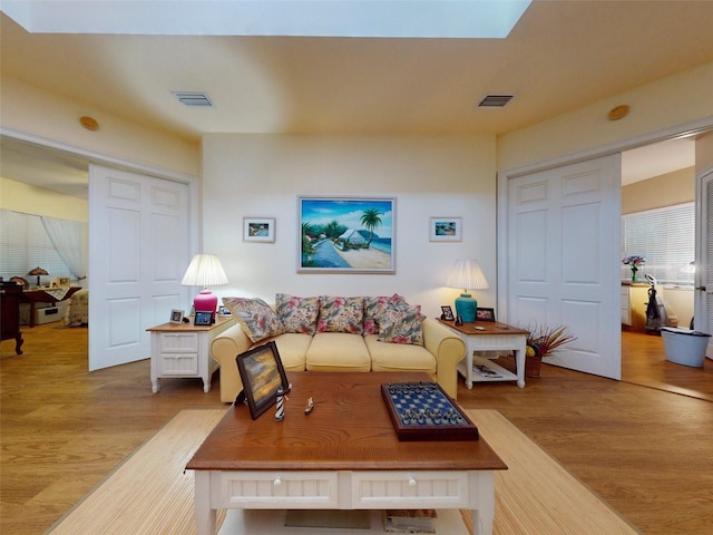 living room with light hardwood / wood-style floors