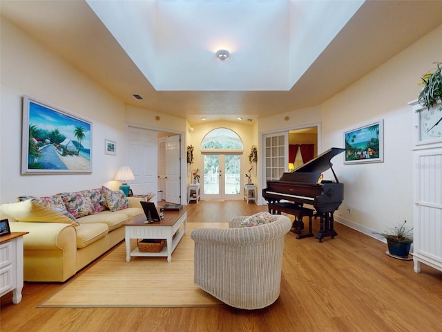 living room with french doors and light hardwood / wood-style floors