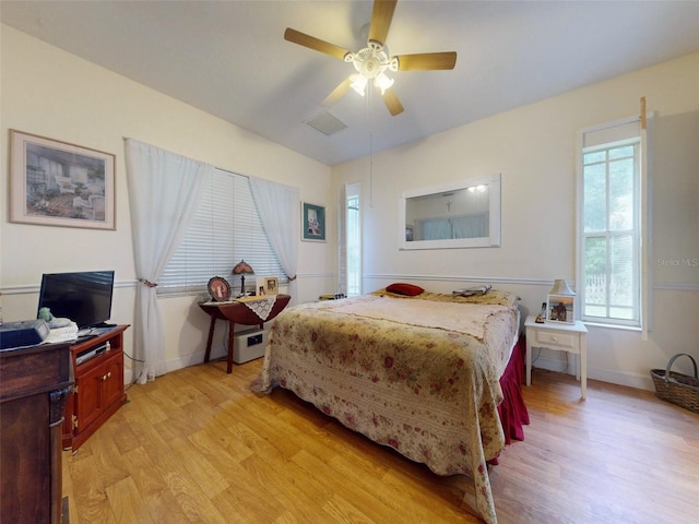 bedroom with light wood-type flooring and ceiling fan