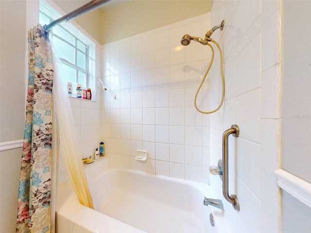 bathroom with shower / bathtub combination with curtain