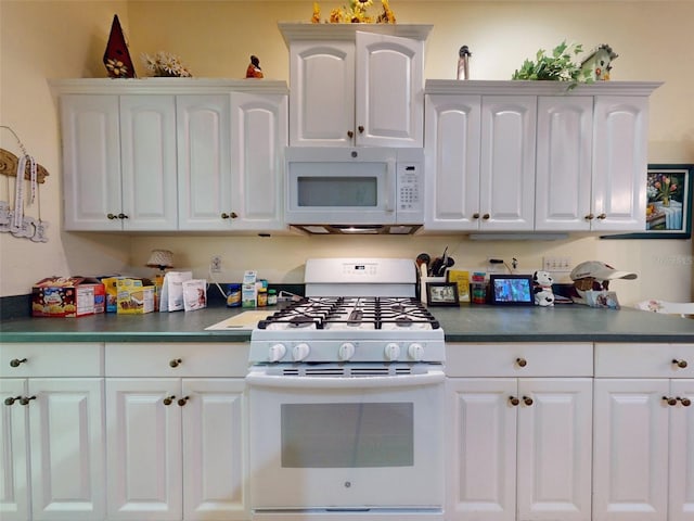 kitchen featuring white appliances and white cabinetry