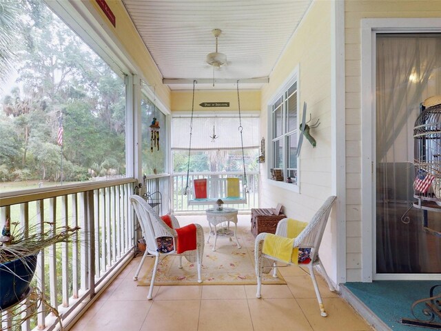 sunroom / solarium with ceiling fan