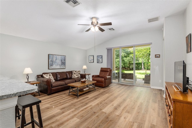 living room with vaulted ceiling, ceiling fan, and light wood-type flooring