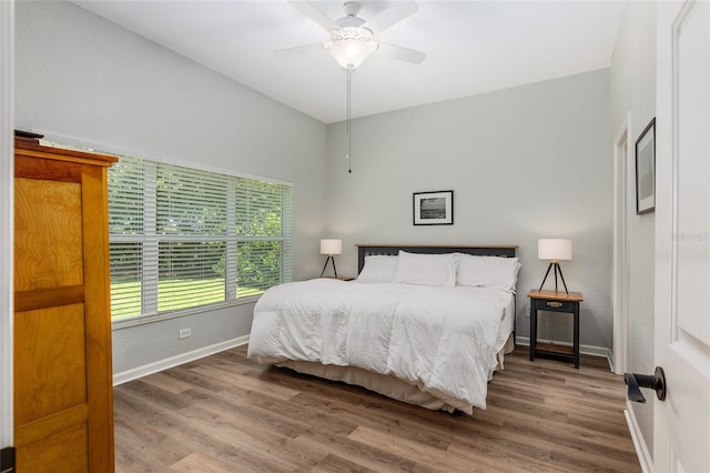 bedroom featuring hardwood / wood-style flooring and ceiling fan