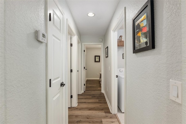 hallway with hardwood / wood-style floors