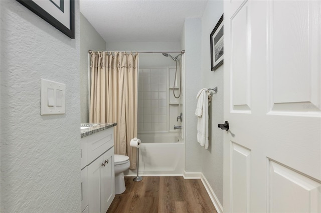 full bathroom featuring toilet, a textured ceiling, vanity, shower / bathtub combination with curtain, and hardwood / wood-style floors