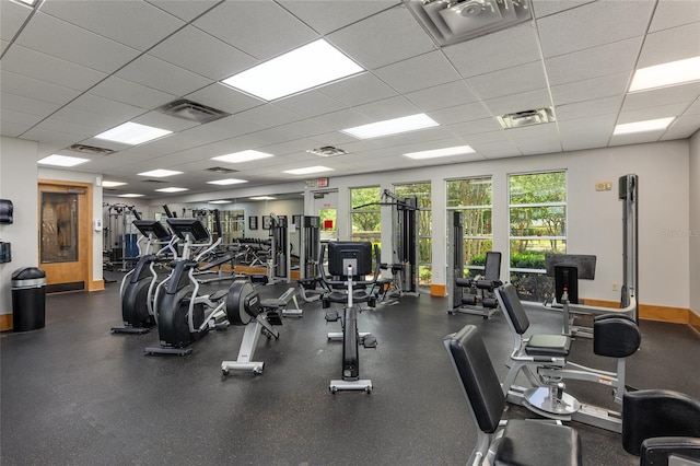 exercise room featuring a paneled ceiling