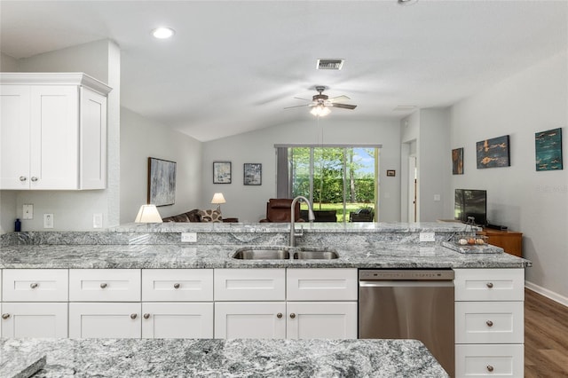 kitchen with white cabinetry, stainless steel dishwasher, light stone countertops, and sink