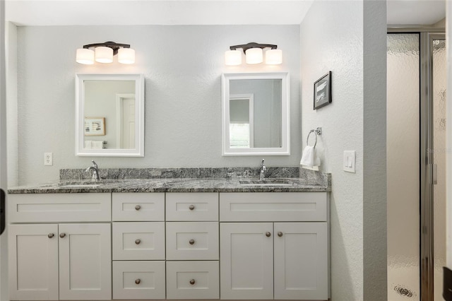 bathroom featuring vanity and walk in shower