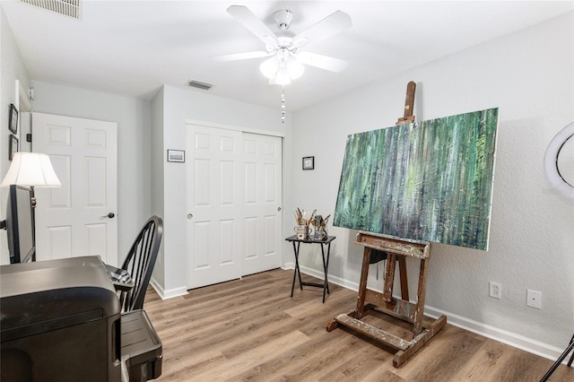 office area with hardwood / wood-style flooring and ceiling fan