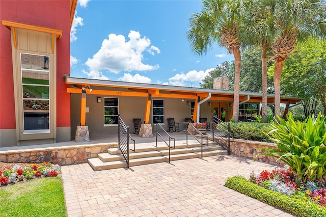 back of house with a patio and covered porch