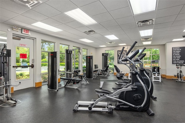 exercise room featuring a drop ceiling