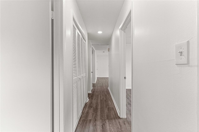 corridor featuring dark hardwood / wood-style floors