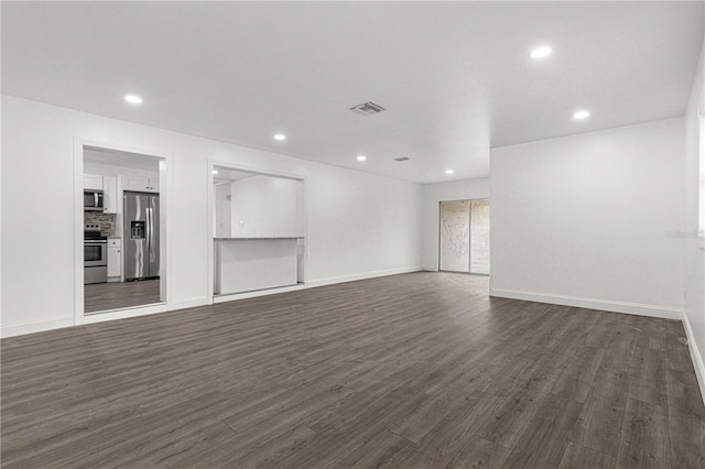 interior space with dark hardwood / wood-style floors