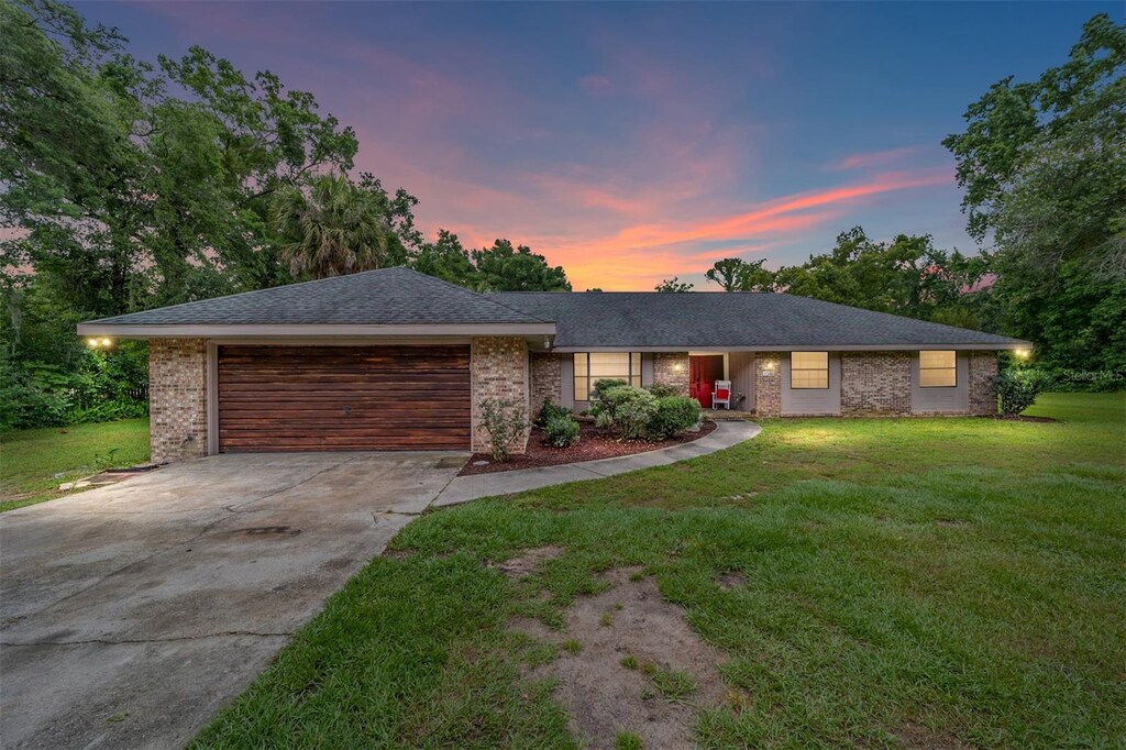 5240 SE 17th St, Ocala, FL 34471 - single story home featuring a garage and a yard