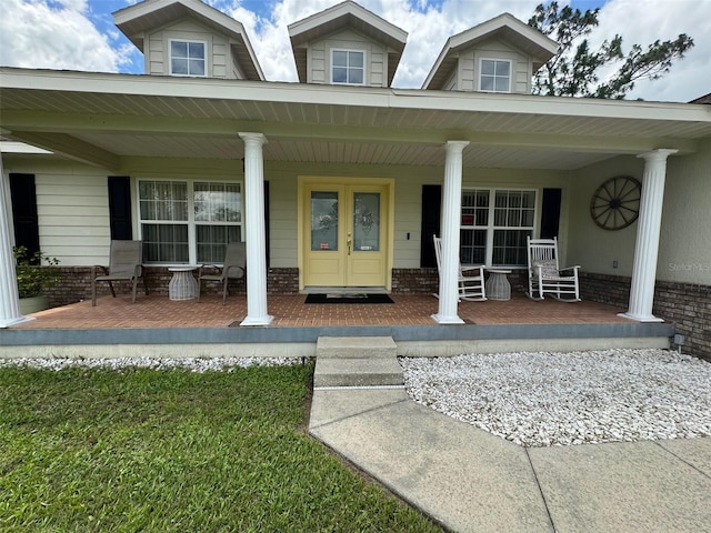 doorway to property featuring covered porch