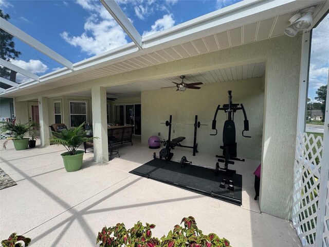 view of terrace featuring a lanai and ceiling fan