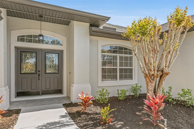 property entrance featuring french doors