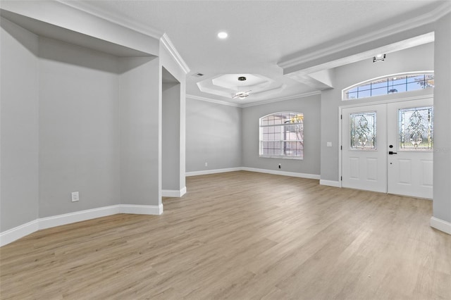 entryway featuring french doors, light hardwood / wood-style flooring, and ornamental molding