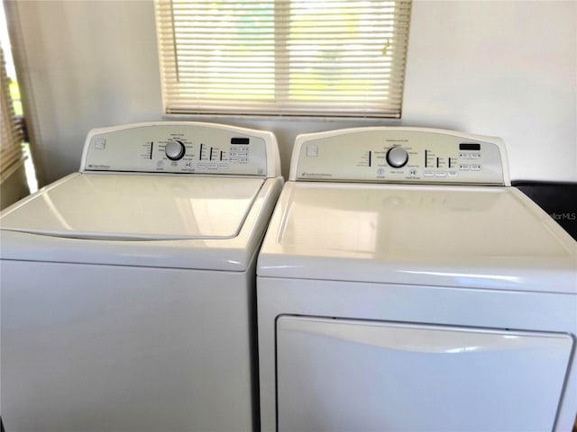 laundry area with independent washer and dryer