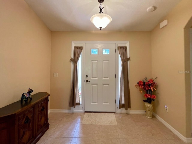 tiled entrance foyer with a wealth of natural light