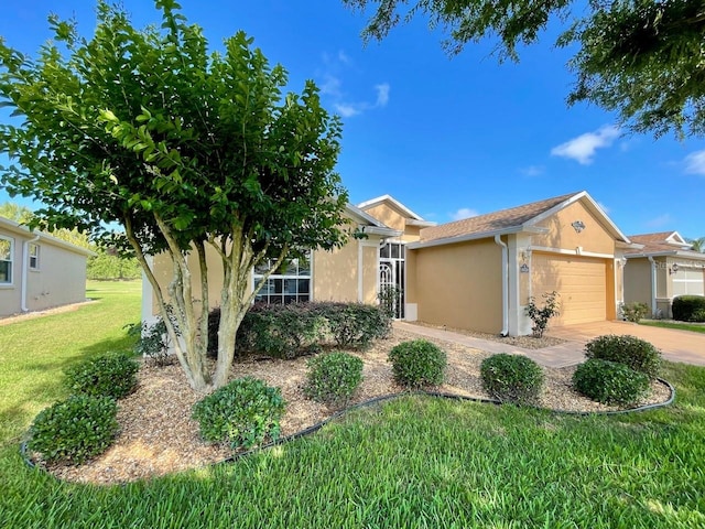 ranch-style house featuring a garage and a front lawn