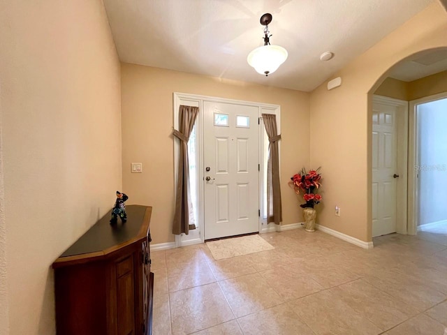 foyer entrance featuring light tile patterned floors