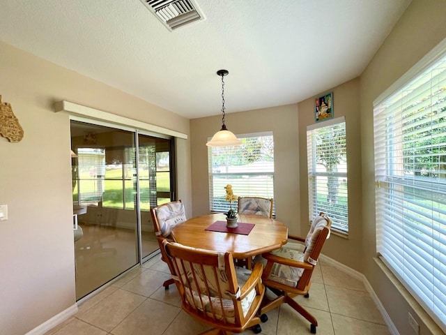 dining room featuring light tile patterned floors