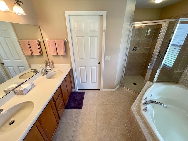 bathroom featuring plus walk in shower, tile patterned flooring, and dual bowl vanity