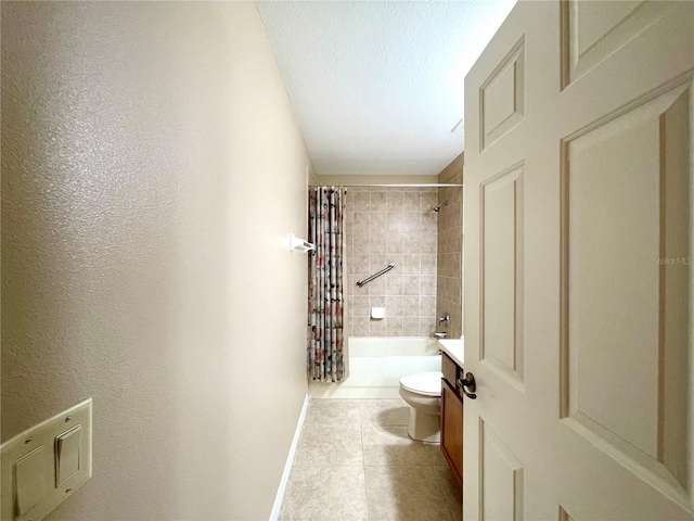 full bathroom featuring a textured ceiling, shower / tub combo with curtain, tile patterned floors, toilet, and vanity