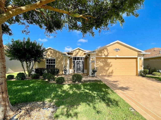 ranch-style house with a garage, stucco siding, driveway, and a front yard