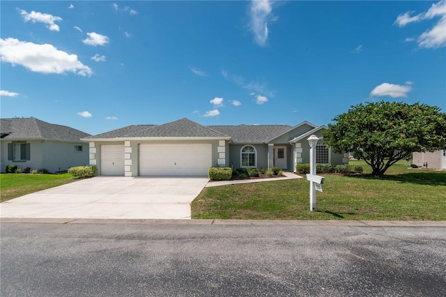 ranch-style house featuring a garage and a front yard