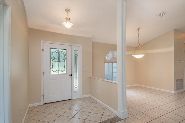 tiled foyer entrance with a healthy amount of sunlight