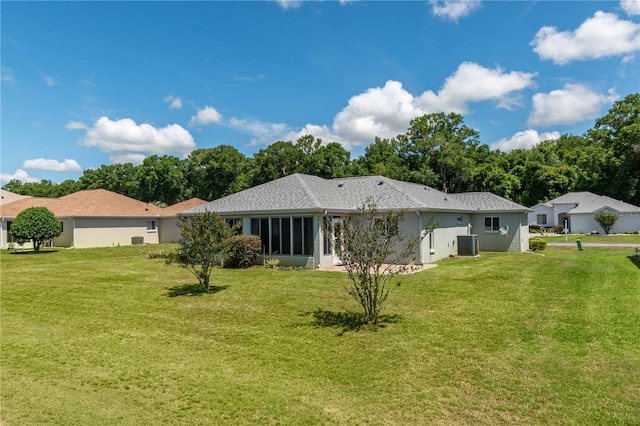 back of property featuring a yard