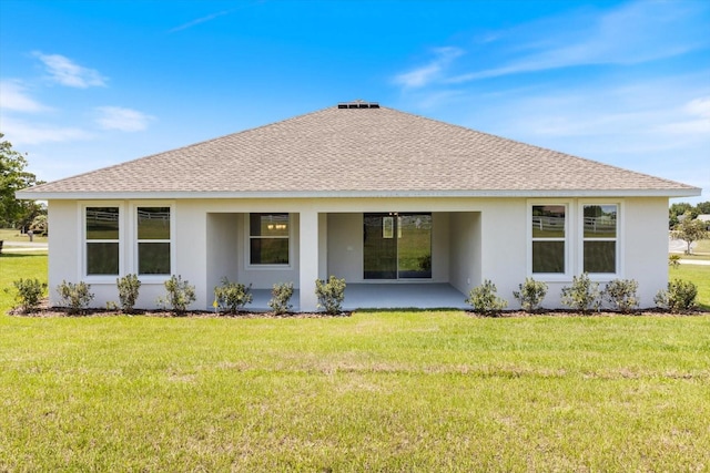 rear view of house with a lawn