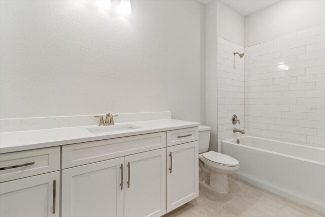 full bathroom featuring toilet, vanity, and tiled shower / bath combo