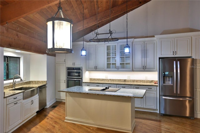 kitchen featuring stainless steel appliances, wood ceiling, beamed ceiling, sink, and pendant lighting