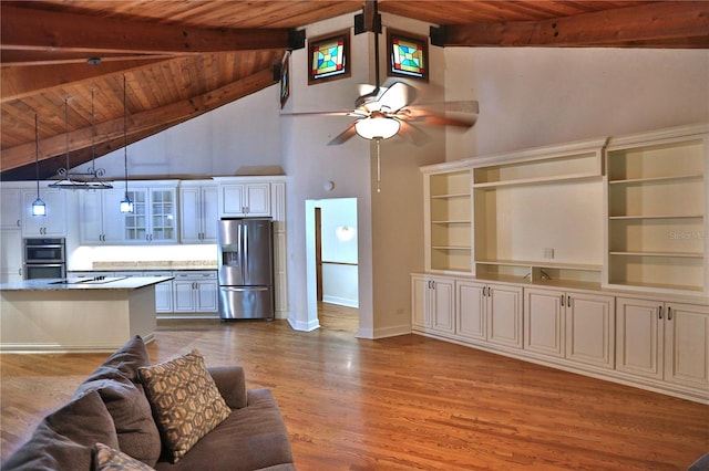 unfurnished living room with beamed ceiling, high vaulted ceiling, wood ceiling, and light hardwood / wood-style flooring