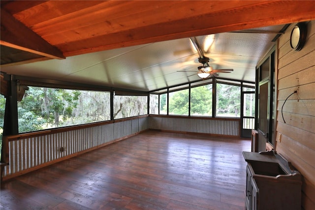 unfurnished sunroom with vaulted ceiling with beams and ceiling fan