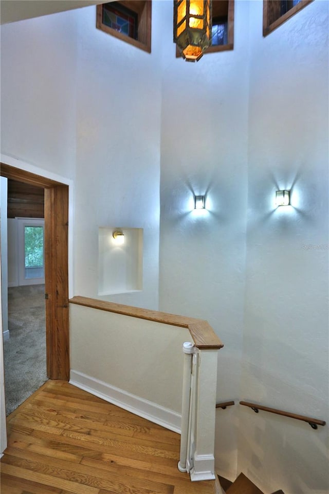 stairway featuring hardwood / wood-style flooring