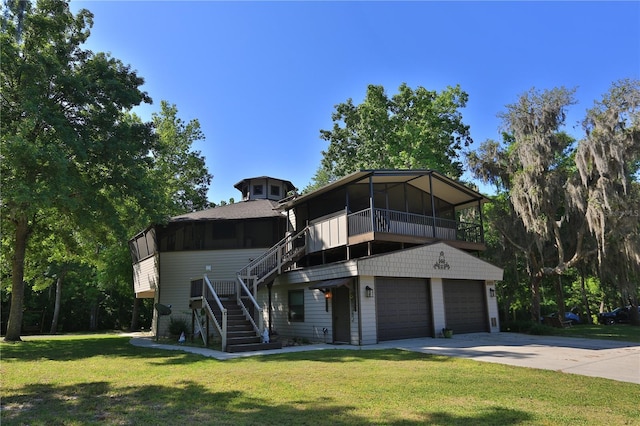 view of front facade with a garage and a front yard