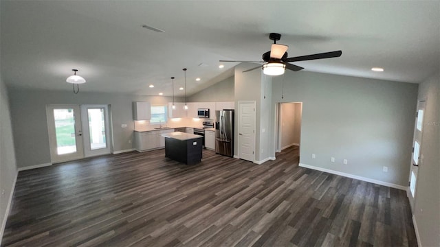 unfurnished living room with dark hardwood / wood-style floors, high vaulted ceiling, ceiling fan, and french doors