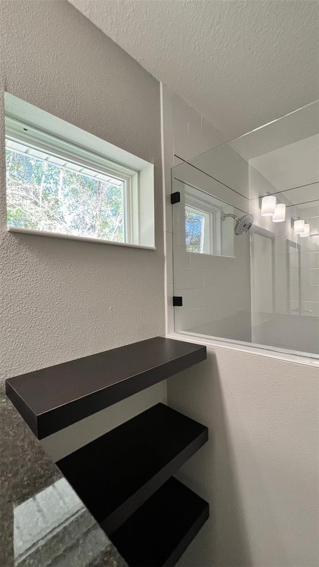 TBD Fisher Lane Trace, Ocklawaha, FL 32179 - bathroom with a textured ceiling, a textured wall, and walk in shower