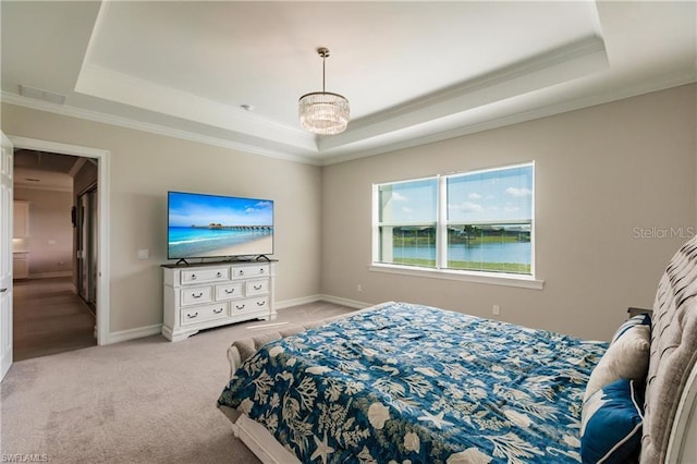 carpeted bedroom featuring a notable chandelier, a water view, a raised ceiling, and crown molding