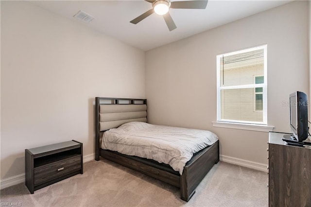 bedroom featuring ceiling fan and light colored carpet