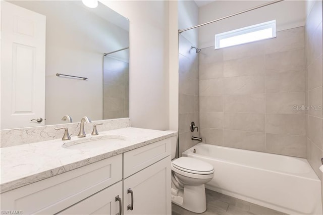 full bathroom with toilet, tiled shower / bath combo, and large vanity