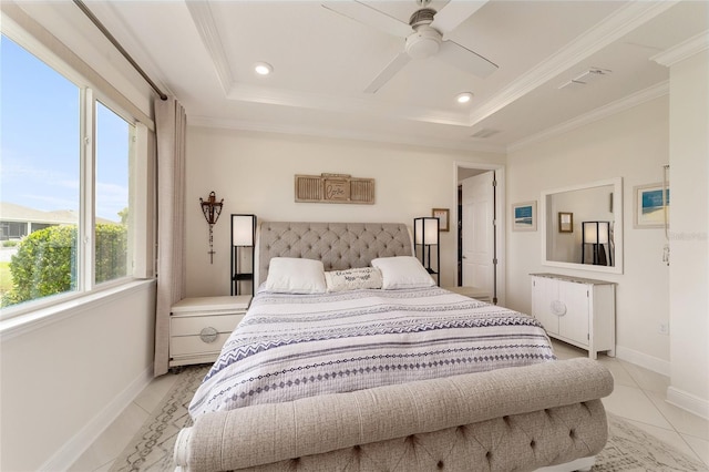 bedroom with a tray ceiling, multiple windows, and ceiling fan