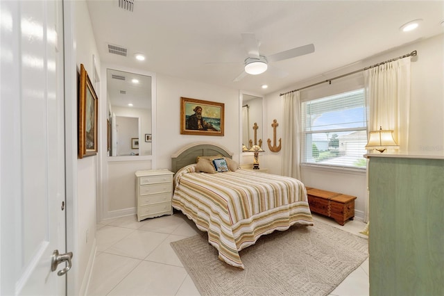 tiled bedroom with ceiling fan