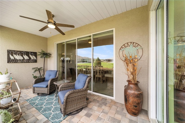 view of patio featuring ceiling fan