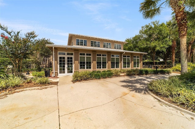 back of property featuring french doors